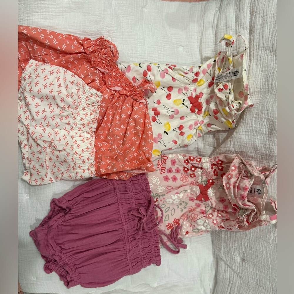 3 rompers , and 1 short set